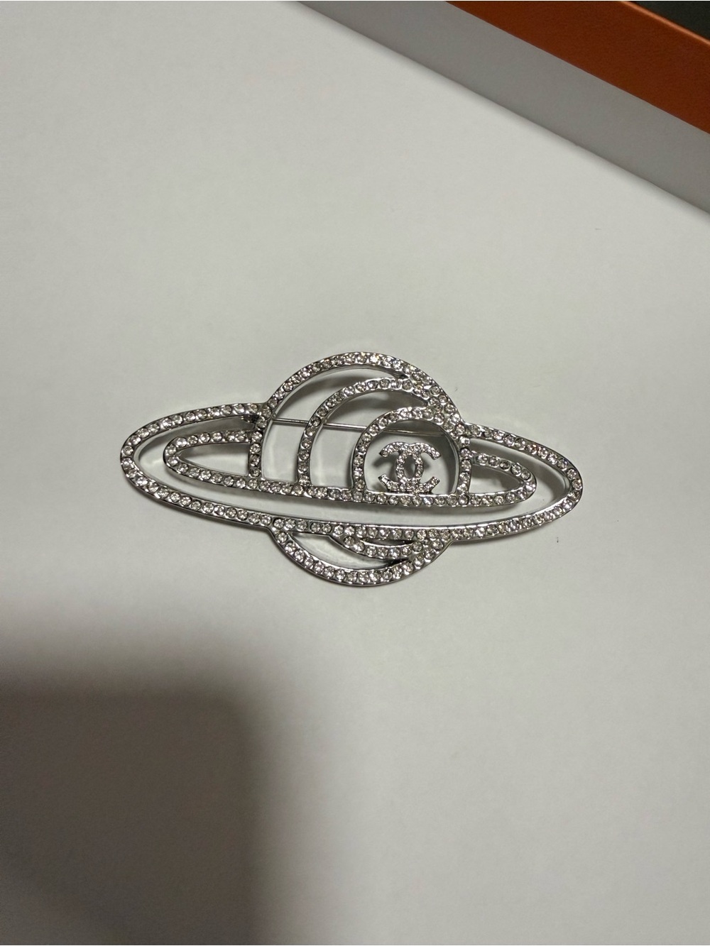 CHANEL Silver Crystal Planet Brooch Pin - Rhinestone Accent